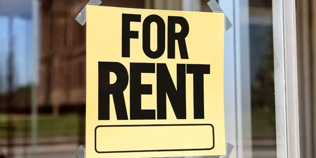 For rent sign at a residential rental property, representing the goal of attracting long-term tenants.