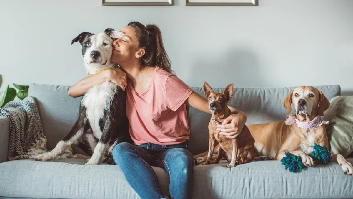 Tenant with emotional support animal in apartment, illustrating Fair Housing accommodation requirements.