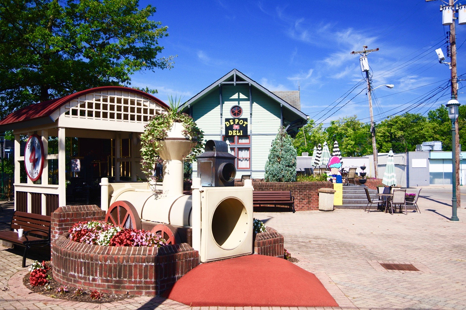 Depot Square with train sculpture and Depot Deli in Sharonville, Ohio